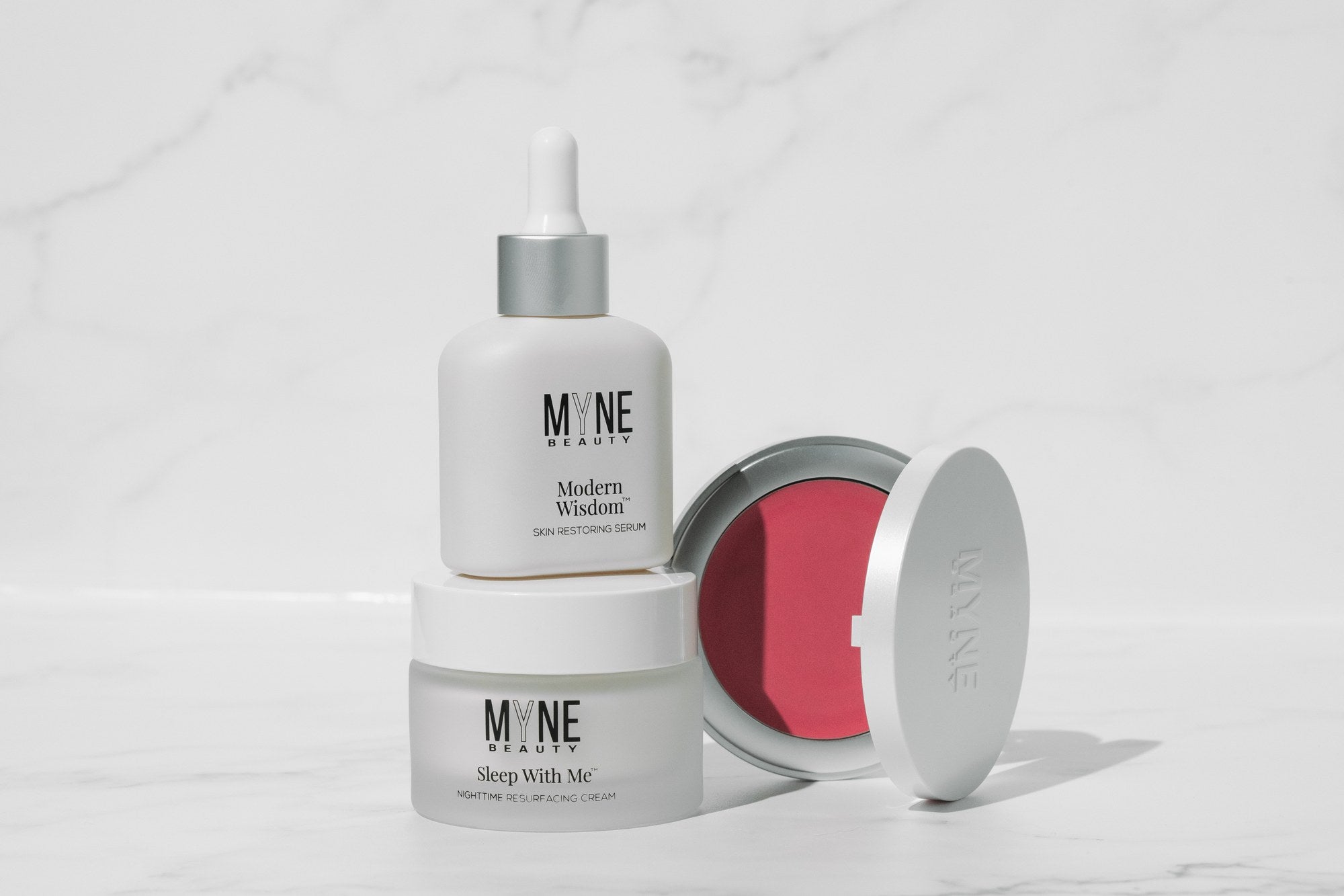 Modern Wisdom, Sleep With Me and Haute Flash together on white marble