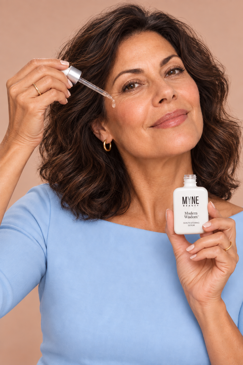 Woman applying Modern Wisdom serum, t1